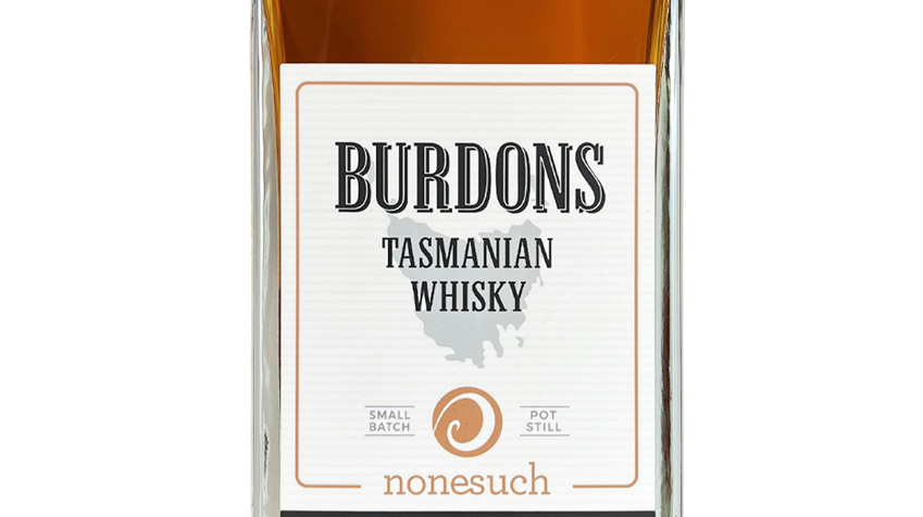 A bottle of Burdons Tasmanian whisky on a white background with reflection